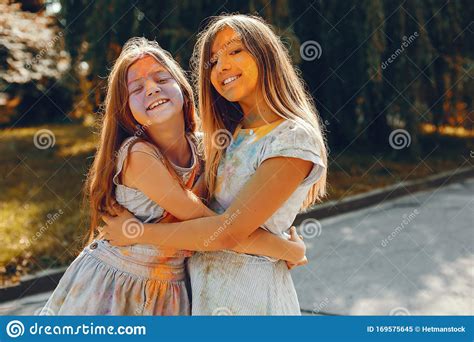Two Cute Girls Have Fun In A Summer Park Stock Image Image Of