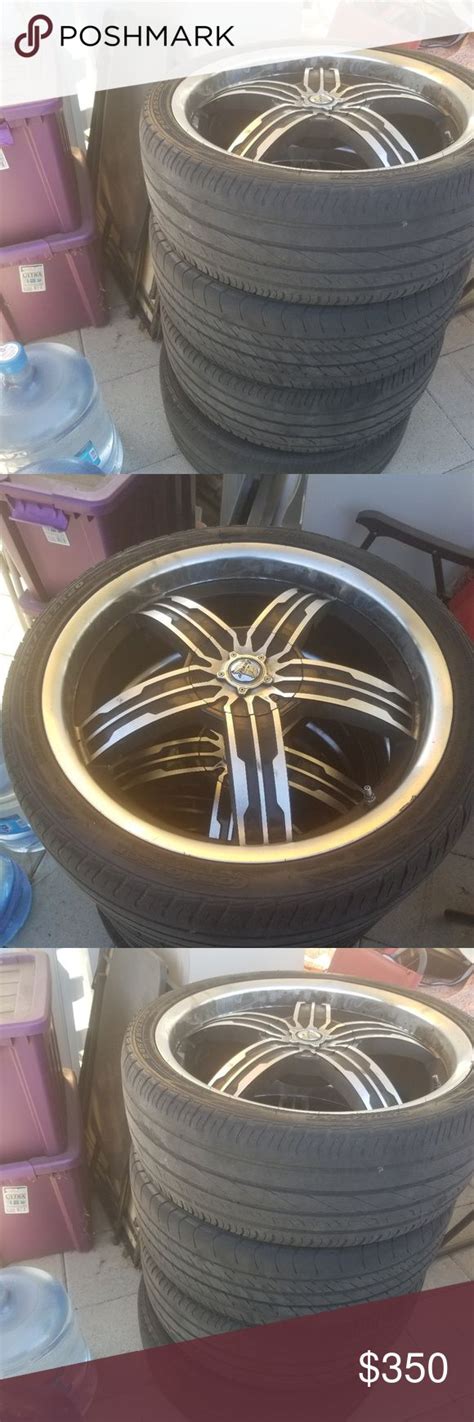 Two Tires With Gold Rims Are Stacked On Top Of Each Other In Different