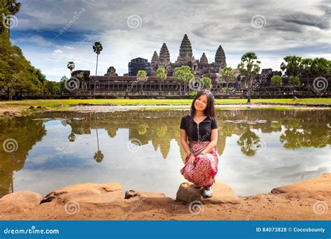 Young Woman Enjoy The Journey In The Ancient Temple Cambodia Complex