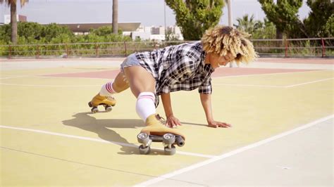 Fun Young Woman Doing The Splits On Skates Stock Video Footage