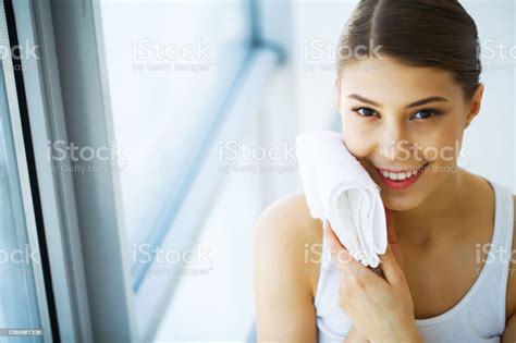 Young Woman Drying Herself With White Towel Smiling Portrait Closeup