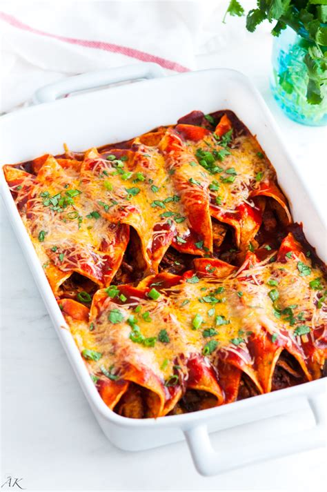 Spoon chicken mixture evenly down centers of tortillas. Red Chicken Enchiladas - Aberdeen's Kitchen