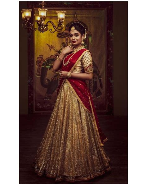 In A Bridal Look In Maroon And Gold Color Pattu Kanjeevaram Saree