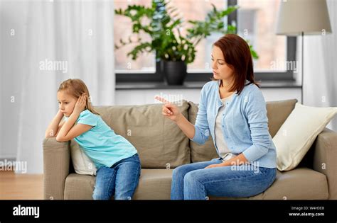Angry Mother Scolding Her Daughter At Home Stock Photo Alamy