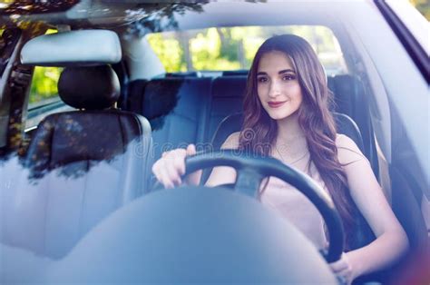 A Young Beautiful Girl Is Driving A Car Stock Image Image Of Driver
