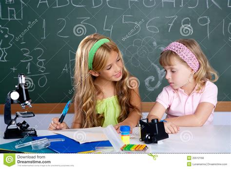 Kids Students In Classroom Helping Each Other Royalty Free Stock Image