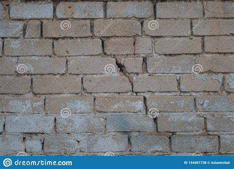 Background Of Old Vintage Dirty Brick Wall With Peeling Plaster