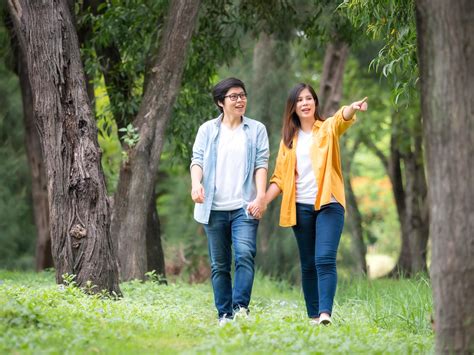 Asian Female Couples Lgbt Walking And Relax In The Garden And Embrace
