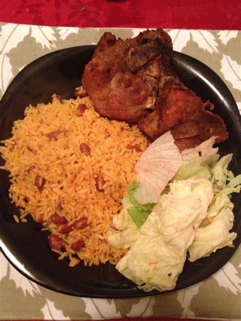 Enjoy (a wonderful recipe straight from the island). Puerto Rican chuletas (pork chops), arroz con habichuelas ...