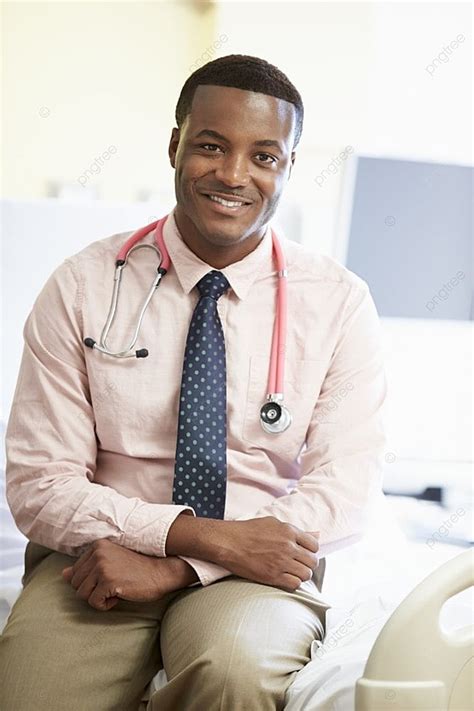 Portrait Of Male Doctor Sitting On Hospital Bed Background Portrait