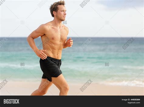 Sport Man Running Male Athlete Runner Jogging Shirtless Training On Beautiful Beach Fit