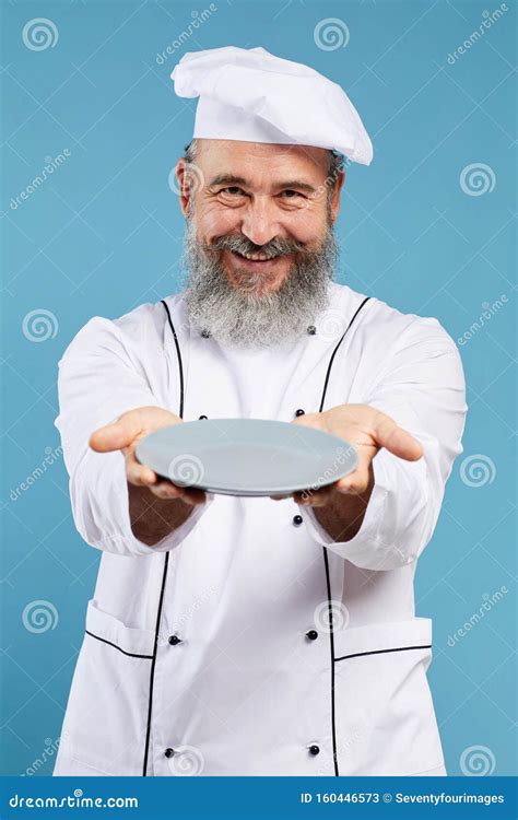 Smiling Senior Chef Holding Empty Plate On Blue Stock Image Image Of Food Dish 160446573