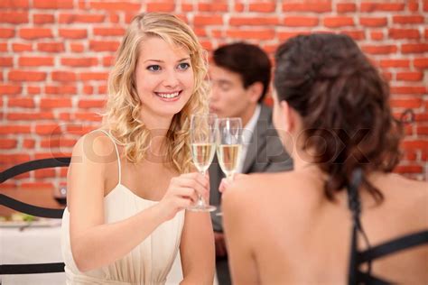 Two Women Drinking Champagne In Restaurant Stock Image Colourbox