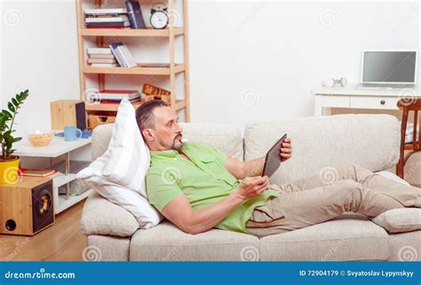 Handsome Man Resting On Sofa At Home Stock Image Image Of Interior