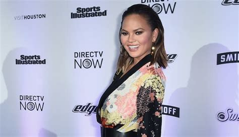 Chrissy Teigen Looked Beyond Casual As She Sat Completely Naked During A Press Day