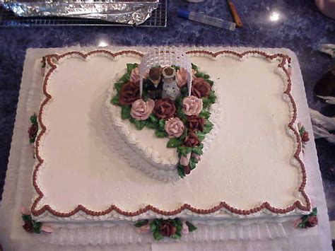 Fondant flowers and white chocolate and milk chocolate seashells accent the cake. Connies CakeBox: Wedding Sheet Cakes