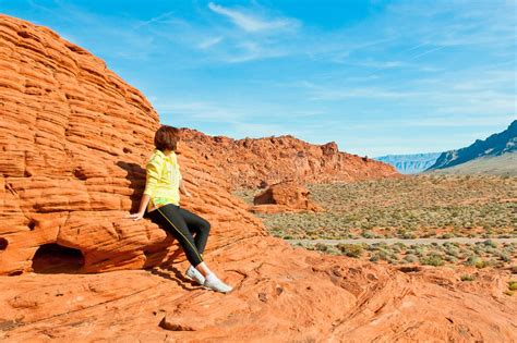 Woman Enjoying View Of Red Rock Formations In Valley Of Fire St Stock