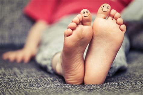 Kids Feet With Smiley Faces Drawings Stock Photo Download Image Now