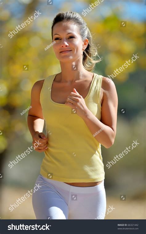 Young Woman Jogging Outdoor In Summer Stock Photo 66321442
