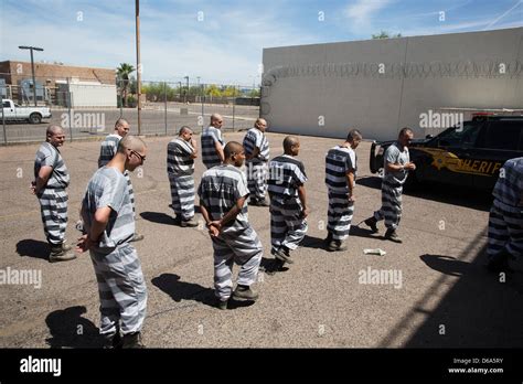 Male inmates return to Estrella Jail after chain gang duty Stock Photo