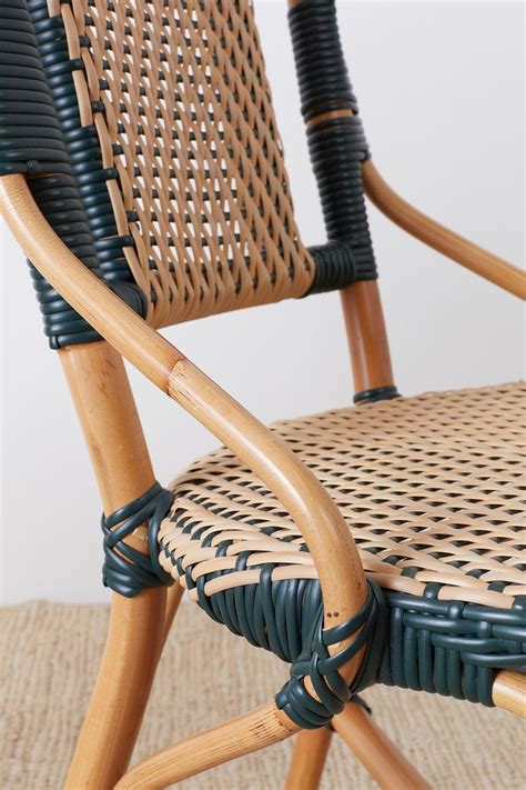 These allow you to put your feet up while sitting. Pair of Palecek Bamboo Rattan Bistro Cafe Chairs at 1stdibs