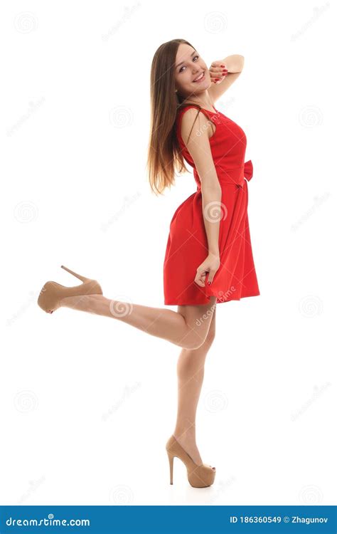 Beautiful Blonde In A Red Dress On A White Background Stock Image