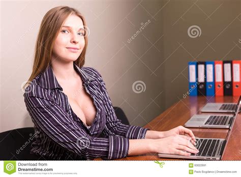 Will work for single, dating and married women. Businesswoman With Deep Neckline Working In Office Stock ...