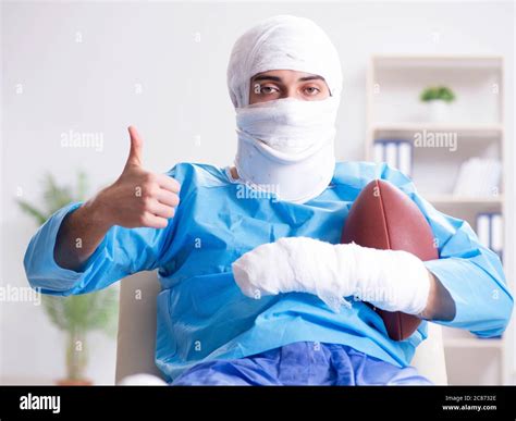 The Injured American Football Player Recovering In Hospital Stock Photo
