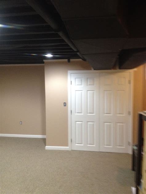 This Exposed Basement Ceiling Was Spray Painted Black Due To The Duct