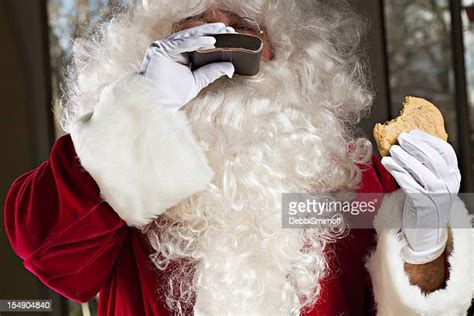 Santa Eating Cookies Photos And Premium High Res Pictures Getty Images