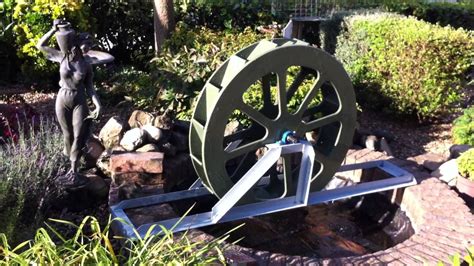 Small Water Wheel Over Pebble Pond Youtube