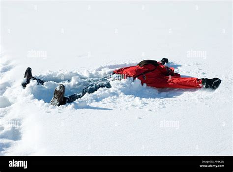 Person Making A Snow Angel Stock Photo Alamy
