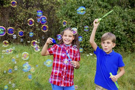 Kids Playing With Bubbles Stock Image Image Of Blowing 105186873
