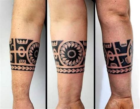 These tribal arm bands exhibit the alternating patterns typical to the style and also incorporate larger elements like sea turtles and tiki masks. 50 Tribal Armband Tattoo Designs For Men - Masculine Ink Ideas
