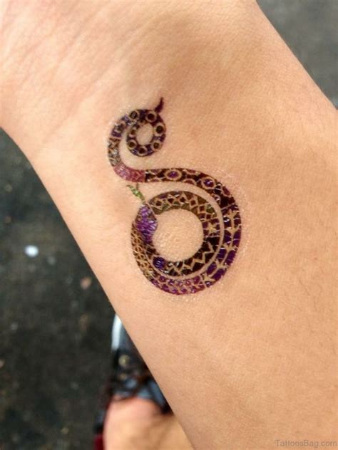 47 Unique Snake Tattoos For Wrist Tattoo Designs