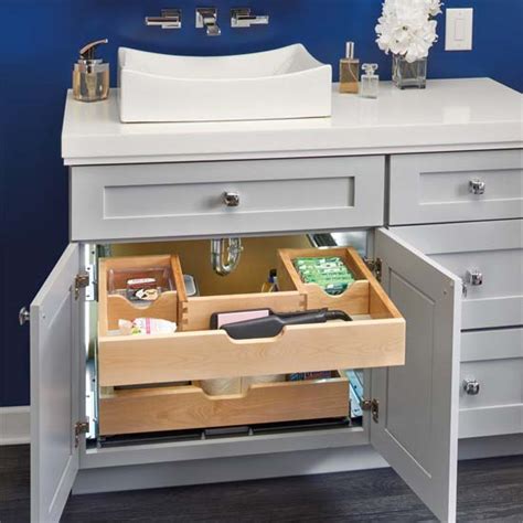 This cabinet features two riser shelves that fit around the plumbing inside the cabinet. For Bathroom/Vanity - U-Shape Under Sink Pullout Organizer ...