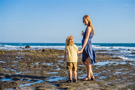 Mom And Son Are Walking Along The Cosmic Bali Beach Portrait T Stock Photo Image Of Leisure
