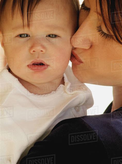 Mother Kissing Baby Stock Photo Dissolve