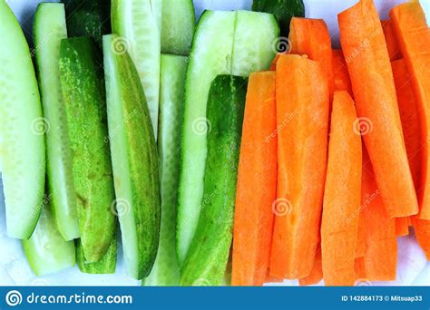 Fresh Cucumber And Carrots Slice Isolated On White Background Stock