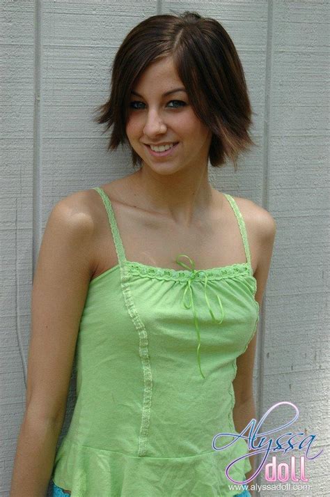 Alyssa Strips Out Of Her Green And Blue Outfit By The Wall Porn