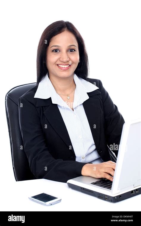 Smiling Young Business Woman Working With Laptop Against White Stock