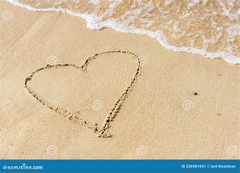 drawing of a heart drawn on a sandy beach stock image image of good beach 236981651
