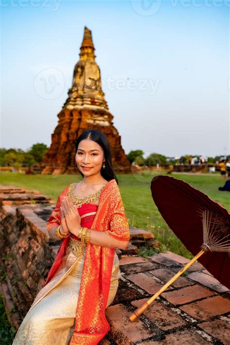Beautiful Thai Girl In Traditional Dress Costume Red Umbrella As Thai Temple Where Is The Public