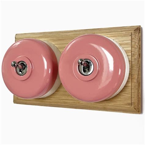 Round Dolly Light Switch 2 Gang Pink On Oak Pattress With White Mounts