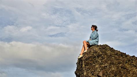 Girl Sitting On A Rock Ledge Image Free Stock Photo