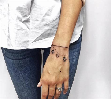 The 80 Cutest Paw Print Tattoos Ever The Paws Pawprint Tattoo