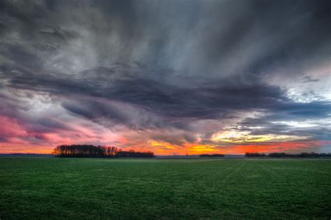 Free Photo Storm Clouds Over Field During Sunset Clouds Sunset