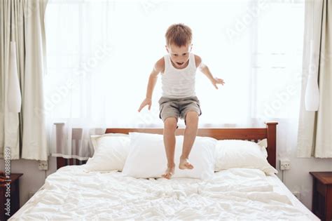 Boy Jumping On The Bed Stock Photo And Royalty Free Images On Fotolia