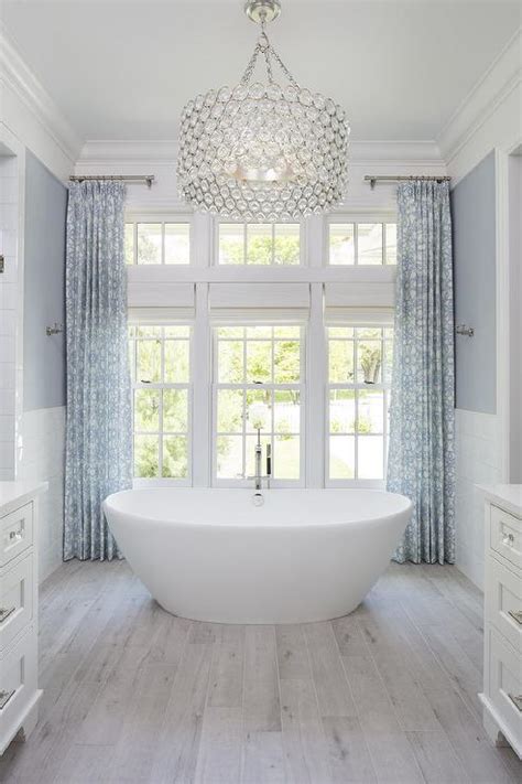 Hanging a mirror above a bathtub is a great solution for contemporary bathrooms and for many others. Large Crystal Drum Pendant Light Over Oval Bathtub ...
