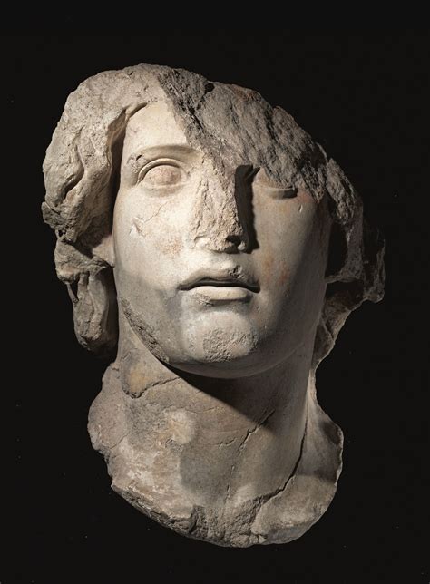 A Fragmentary Roman Marble Head Of A Young God Or Ruler Circa 1st